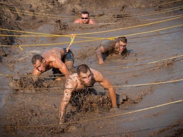 110813-N-XS652-351
VIRGINIA BEACH, Va. (Aug 13, 2011) Runners navigate an obstacle during the 11th annual Armed Services YMCA Mud Run at Joint Expeditionary Base Little Creek-Fort Story. The Mud Run is an 8-kilometer event on the base. All proceeds from the race benefit the Armed Services YMCA of Hampton Roads. (U.S. Navy photo by Robin Hicks/Released)